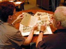 VMFA librarian Dr Suzanne Freeman left and consulting curator Frederick R Brandt examine printed primary materials relating to American and British Arts and Crafts and Art Nouveau