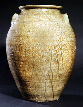 A lime-based alkaline glazed and scored storage jar attributed to the pottery of Green Morton, whose real name was Greenberry Morton, of Perry County. The 17 ¾-inch vessel dates to circa 1859.