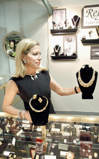 Dana Krauss of Regalia, Sharon, Conn., displayed a varied selection of jewelry ranging from a Bovin gold, emerald and diamond necklace to "paste” costume pieces.