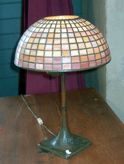 A Louis Comfort Tiffany lamp shade was 12 inches at the bottom with original base and sold for $7,810.