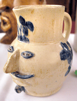 The grotesque stoneware face jug had a high glaze and was believe to have been made by a North Carolina potter. It sold to a phone bidder for $21,275.