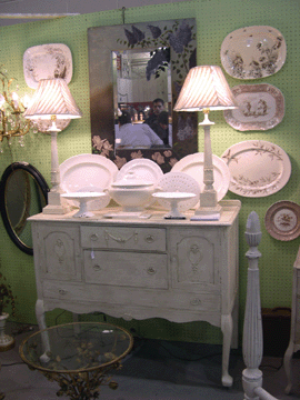 White ironstone and Staffordshire ceramics predominated at the booth of Gray Goose Antiques, where sold stickers appeared minutes into the show.