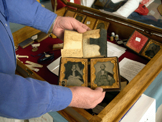Ventura Collections showed a bible belonging to a Civil War soldier, period family daguerreotypes and related documentation. Bob Ventura held some of the items for this photo.
