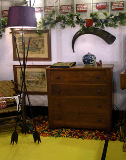 Pride of place in the booth of Candleglow Antiques was a mid-Nineteenth Century East Asian water buffalo horn that was bound neatly in brass.