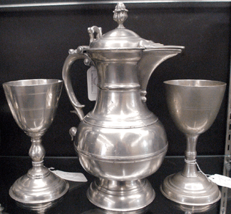 The top lot from the Charles Swain pewter collection was the Round Top Lutheran Church communal flagon and chalice attributed to New York City maker William Will. Pennsylvania dealer Don Herr claimed the lot for a record price for form and maker at $138,000. The chalice to the right, by Henry Will, sold for $1,270.