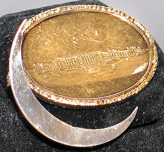Fortunately for Rifton, N.Y., dealer Jonathan Trace, Charlestonians love American silver. Trace sold this 1859 gold reward of merit for Citadel graduate Cadet Boyleston on opening night. It is engraved with an image of Charleston's famous military college and is accompanied by a silver crescent pin. The crescent, or "New Moon,†appears on the South Carolina flag. The symbol dates to the Revolutionary era, when South Carolina soldiers wore crescents on their caps.