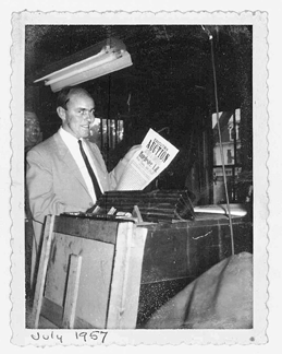 "I always had a major auction in July,†says Withington, here with a broadside of a 1957 sale in Manchester, N.H.
