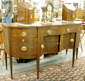 The Federal mahogany sideboard, believed to have been made in New York, went out at $14,950. The pair of Georgian knife boxes with serpentine fronts and sloped lids ended up selling at $7,187.