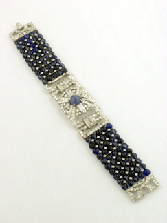 A platinum, sapphire and diamond bracelet, circa 1940, centered with a 6-carat star sapphire, hammered down for $18,700.
