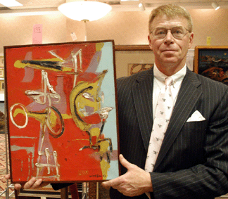 Trinity's Steve Gass with the Emerson Woelffer abstract oil that sold for $37,045.