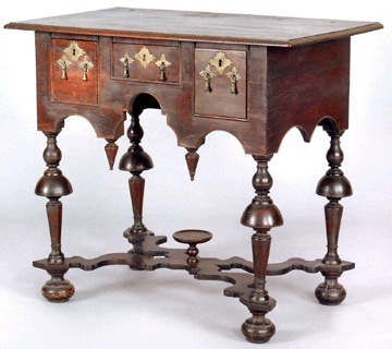 Dating to about 1720, this Philadelphia William and Mary dressing table was purchased from Phillip Bradley and resold in the room for $585,000 to a buyer who asked to remain unnamed. A nearly identical dressing table from the collection of the Philadelphia Museum of Art is illustrated on the cover of Worldly Goods: The Arts of Early Pennsylvania, 1680‱758. In 2003, New York dealer Leigh Keno bought a Salem, Mass., William and Mary dressing table at Northeast Auctions for $464,500, an auction record at the time.