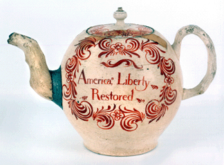There are four known English creamware teapots inscribed "No Stamp Act†and "America, Liberty/Restored.†One from the William Guthman collection, with dark lettering, sold to the Smithsonian for $99,450 at Northeast Auction in October 2006. This one, with red lettering, went to C.L. Prickett Antiques for $130,000. Both pots had repairs. Two other examples are in the collections of Colonial Williamsburg and the Peabody Essex Museum.
