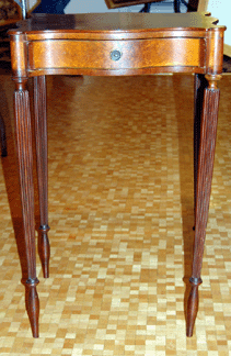 The form of the Massachusetts Federal mahogany stand was elegant and the piece fetched $2,875.