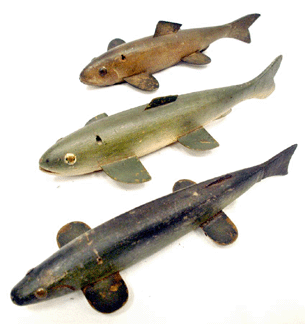 Fish decoys by an unknown maker from Lake Chautauqua brought premium prices. The trout, top, sold at $27,600, the trout in the center made $19,550, and the spearing decoy of an unidentified species, bottom, realized $12,650.