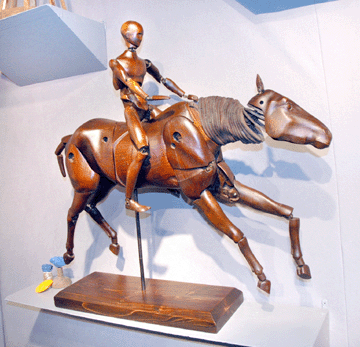 A French walnut articulated horse and rider, 36 inches long, suggested headlong energy at Marion Harris, New York City.
