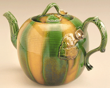 Teapot, Staffordshire, England, circa 1765‱775, creamware with green and yellow lead glazes. 