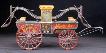 The model of a Philadelphia-style end-stroke pumper is decorated with classical imagery, an urn of flames, sailboats and an eagle