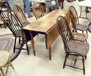 The harvest table with scrubbed top went out at $2,200. The Windsors were a bargain at $330.