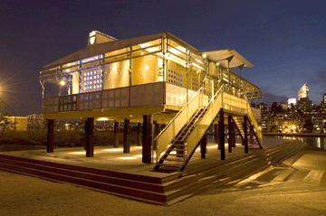 The prototype Maison Tropicale by Jean Prouvé, a visionary prefabricated construction shown here during its presale public exhibition at the foot of the Queensboro Bridge in New York City, sold for $4,968,000, setting a new world auction record for the legendary designer.