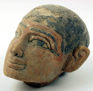 This fragmentary Egyptian marble head, retaining some of its original faience glazing, sold for $5,500.