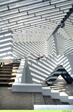 Light spills through the canted glass roof of the Sculpture Gallery in an ever-changing series of precisionist patterns. Based on the staircases of Greek towns, the Sculpture Gallery is an ever-descending series of steps to wells filled with sculpture. Photograph © Paul Warchol.