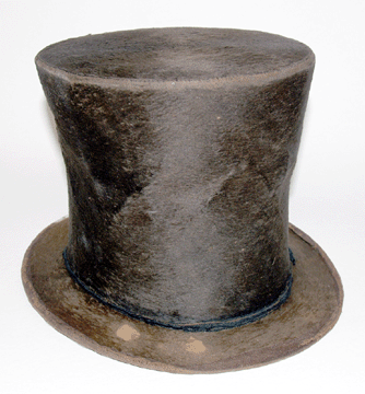 Original beaver fur stove pipe hat belonging to Lincoln. Brim shows finger mark wears in the fur where he would have held the brim to "tip his hat.†