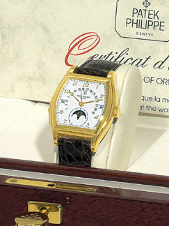 Patek Philippe Ref 5013 made in 1992, a tonneau-shaped, self-winding, 18K yellow gold gentleman's wristwatch, realized $383,600.