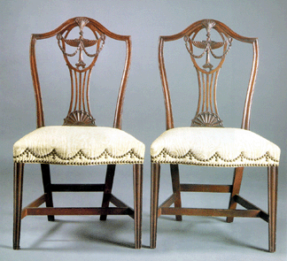 Three Rhode Island side chairs with elegantly pierced and carved splats left the block at $52,875. One of the chairs has a replaced crest. An identical chair, illustrated in 300 Years of American Seating Furniture, is at Yale.