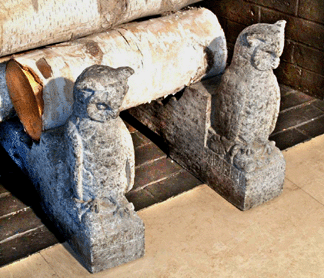 An Arts and Crafts pair of porphyry andirons in the form of owls realized $2,070.