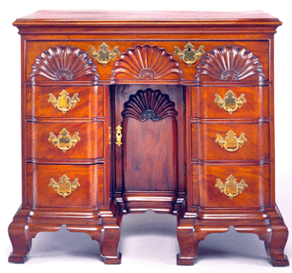 Bureau table attributed to the shop of John Townsend, Newport, 1785‱800. Mahogany and secondary woods; 34½ by 39¼ by 22 inches. With 11 of the 12 Rhode Island block front desk and bookcases in public collections, including Bayou Bend, collectors have turned to the bureau table, a related but more prevalent form. Ima Hogg first engaged Israel Sack in her hunt for one in October 1946. When the reluctant seller of this piece died, Sack contacted Hogg in July 1950, reaching her abroad. The chair was offered for sale through a process of sealed bids. A flurry of communications followed before Sack and Hogg prevailed.
