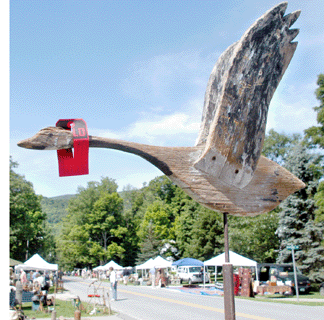 Early to fly from the field was this wooden goose weathervane in the booth of Lynne Weaver, Wenham, Mass.