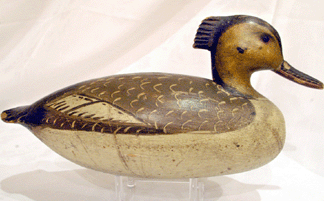 An Ira Hudson merganser hen with folky carved comb brought a record price of $214,000.