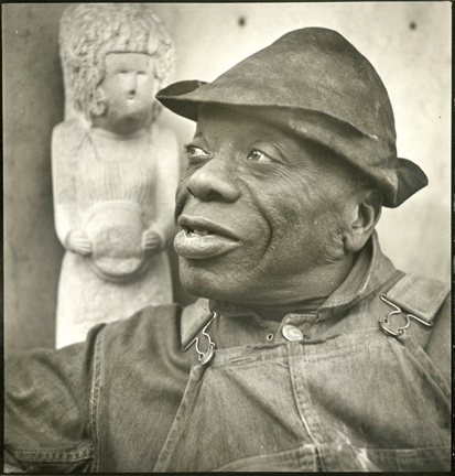 A self-taught sculptor and former janitor, William Edmonson created much-admired limestone sculptures that he believed were divinely inspired. Photographs of him, like this one by Louise Dahl-Wolfe, circa 1933, brought Edmonson and his work to the attention of the art world. ©1989, Center for Creative Photography, Arizona Board of Regents / National Portrait Gallery, Smithsonian Institution.