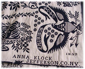 A Tyler coverlet woven in 1852 in indigo and white for Anna Klock with a center snowflake design, eagles in each corner and a border of bowls of foliage and vegetables, brought $3,900.