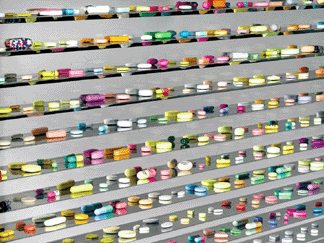 Damien Hirst's "Lullaby Spring,†2002, measuring almost 9 feet in width and containing 6,136 hand crafted and painted pills, is one from a series of four unique stainless steel cabinets sold during the evening sale. Soaring to $19.2 million, the price attained for the work set a new world auction record for the artist and makes Hirst the most expensive living artist at auction. 