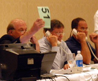 Gary Guyette executes a bid on behalf of a telephone bidder.