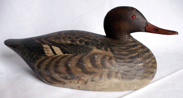 Elmer Crowell working decoys created excitement, with the merganser hen with a low head in a pulled back position, in excellent original paint, selling at $52,325.
