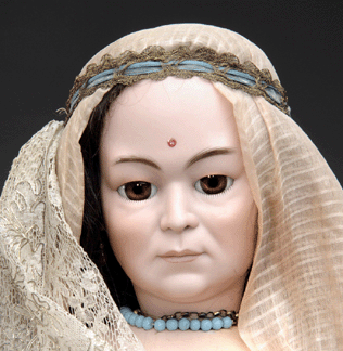 A Simon & Halbig 1303 character doll of an East Asian lady made for the French market (detail shown) climbed to $25,300.