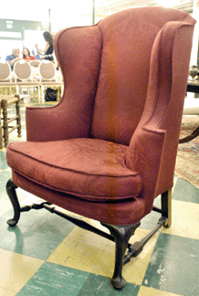 The early Queen Anne wingchair sold between estimates at $23,000.