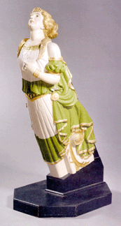 Carved and painted three-quarter length figurehead of a golden-haired woman in a white and green gown, ex-collection of the New Bedford Whaling Museum, 73 inches tall, $98,600.