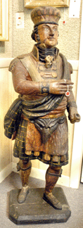 The cigar store figure in the form of a Scottish Highlander brought $34,500.