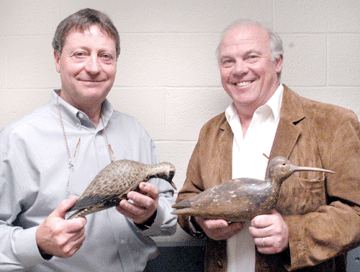 Auction house principals Frank Schmidt, left, and Gary Guyette, with two of the stars from the "lost Mackey collection decoys,†respectively, the A.E. Crowell black bellied plover that established a record price paid at auction for a decoy at $830,000, and the Nathan Cobb curlew that brought $390,000, a record price paid at auction for a Virginia decoy (See Antiques and The Arts Weekly, December 8, 2006). ⁄avid S. Smith photo.