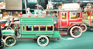 Vintage Collectables, Inc, San Diego, Calif., offered a mint Bing 1910 double-decker bus (foreground) that had come out of the Peter Ottenheimer collection of toy autos. ⁍ay's Antiques Market