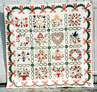 The star performer among about two dozen quilts offered was this Pennsylvania or Maryland album quilt that brought $14,000.