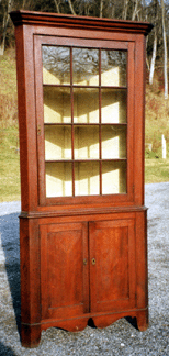 A 12-light cherry corner cupboard reached $7,500.