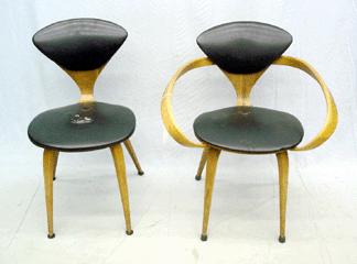 Two from a set of four labeled Plycraft chairs that realized $2,310.