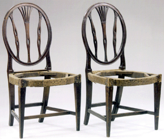 The pair of Baltimore Federal inlaid and carved mahogany side chairs sold for $20,700.