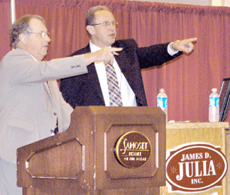 Auctioneer James Julia, left,  and Dudley Browne worked the crowd for bids.