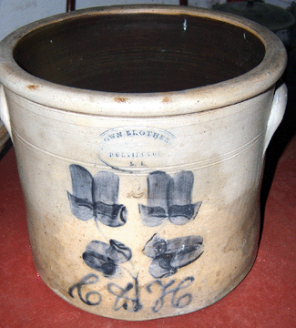 Missing is this two-gallon, Brown Brothers, Huntington, L.I., crock, beige with blue slip decoration with the letters "C & H†and four semisymmetrical flowers, approximately 10 inches in diameter, 9 inches high. There is a number "2†stamped on the front of the crock between the top two flowers. 