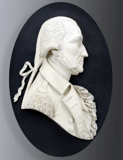 McIntire carved a 38-by-56-inch medallion of President George Washington for the west arch of the gates of Washington Square in Salem. He may have modeled it after an etching of Washington published in Salem in 1794 by Joseph Hiller Jr. Eight other carvings of Washington were found in McIntire's shop after his death.